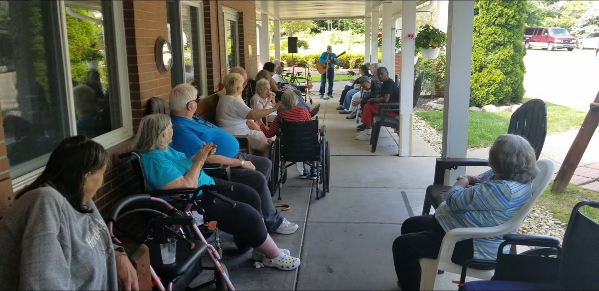 Residents enjoy a peaceful afternoon on the nursing home porch.