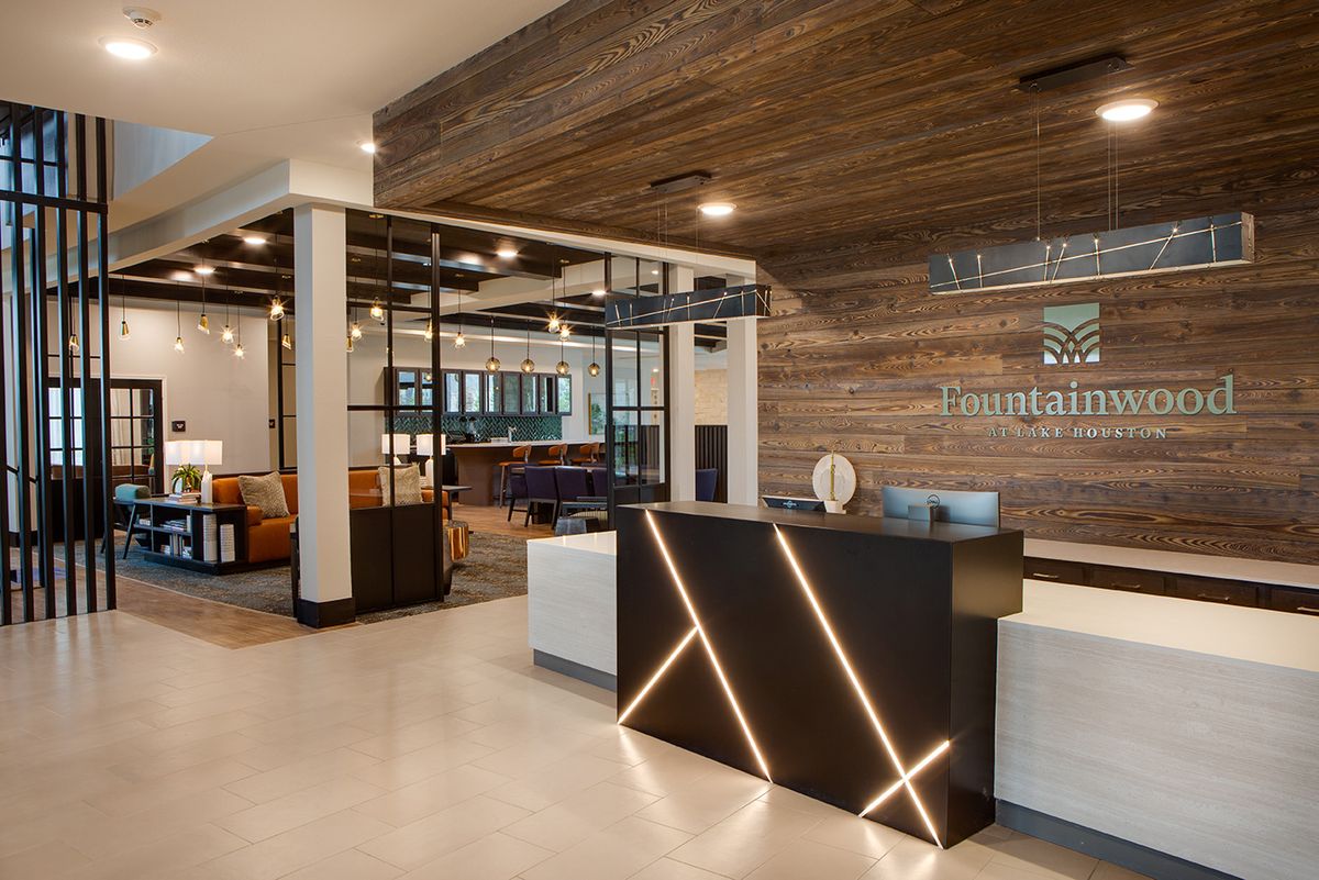 A modern reception area with sleek decor and warm wood accents.