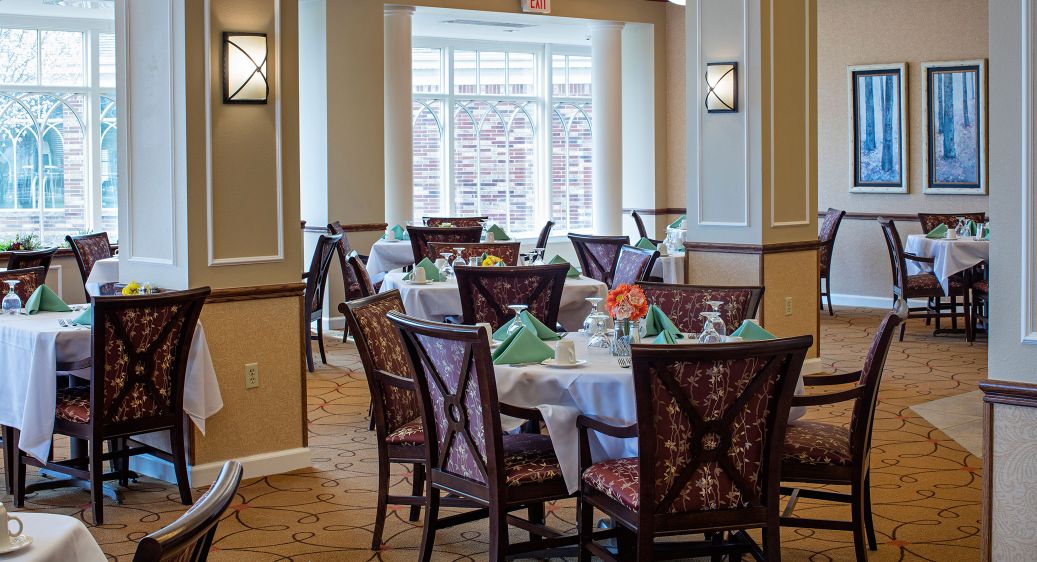 Images showing dining, interior, seating area, fireplace, artwork, apartment building, landscaping, lake, and more.