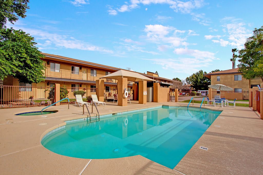 A serene outdoor pool area at a hotel, perfect for relaxation.