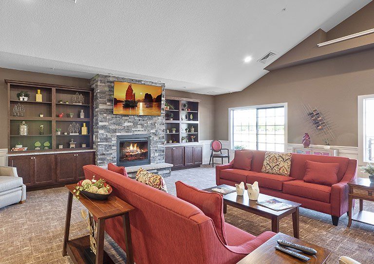 A stylish living room featuring a cozy fireplace, comfortable seating, and elegant decor.