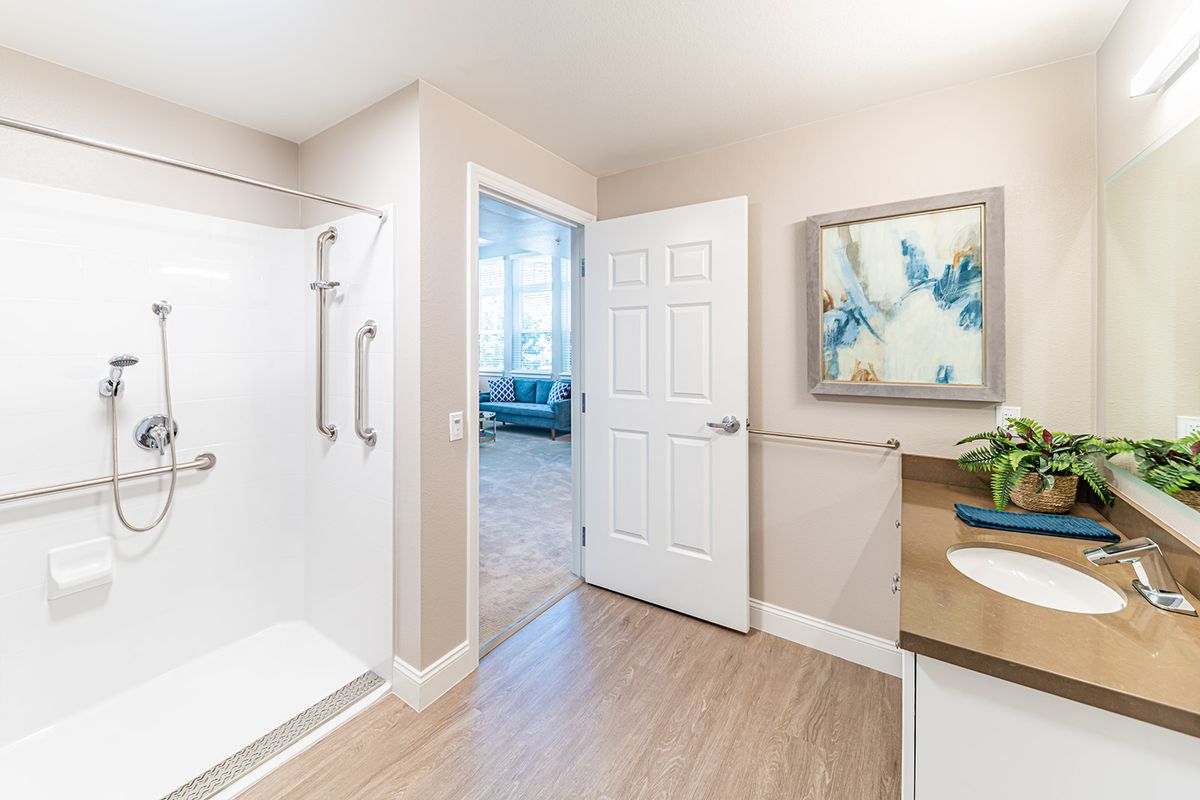 A modern bathroom with a shower and stylish decor.