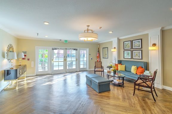 A well-lit living room with stylish decor and comfortable seating.