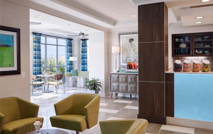A modern lobby with comfortable seating and abundant natural light.