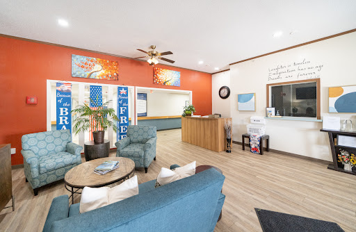 A welcoming lobby with modern furnishings and a warm color palette.