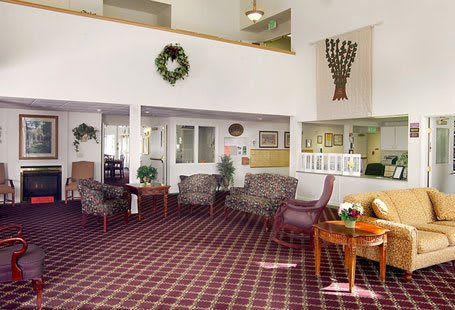 A cozy lobby area with comfortable seating and decorative elements.