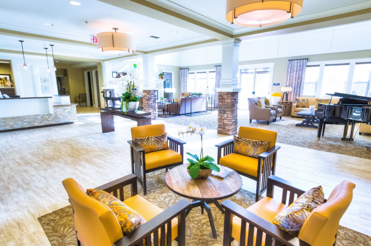 A modern and bright lounge area with stylish furniture and decor.
