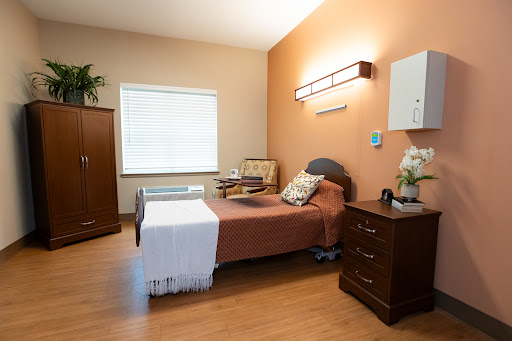 A well-furnished hospital room designed for patient comfort.
