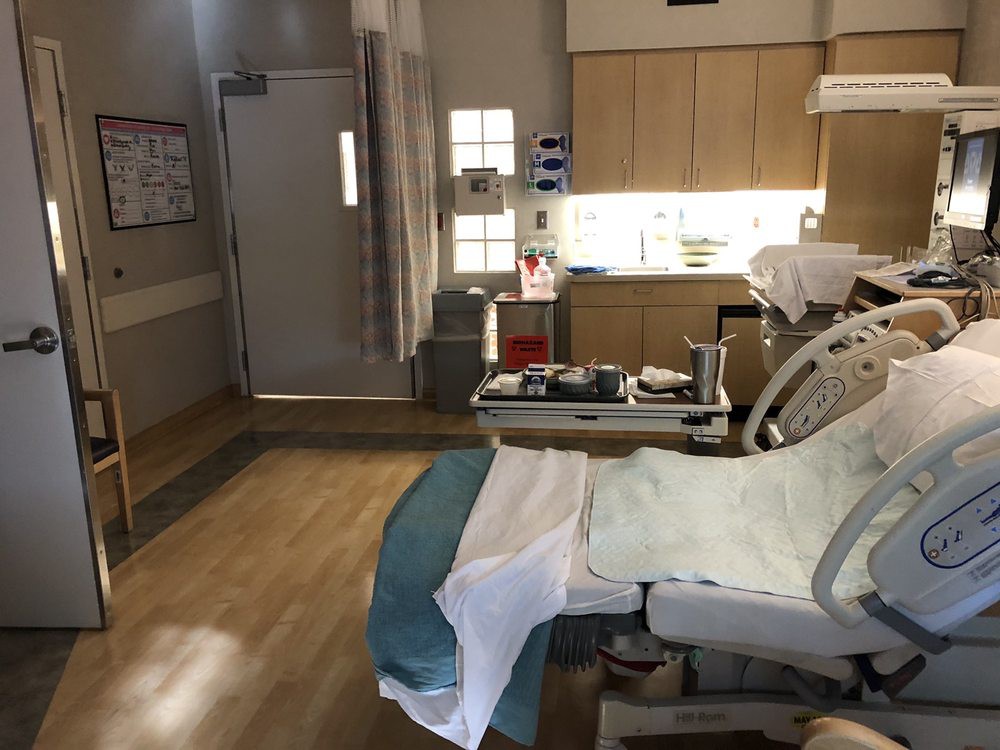 A clean and well-equipped hospital patient room.