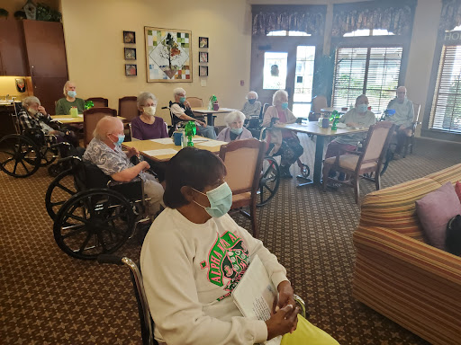 Residents enjoying a social activity in a community center.