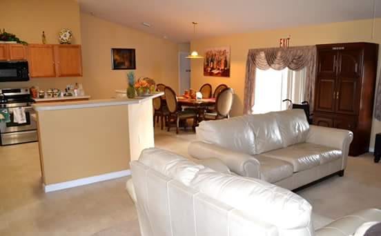 A cozy open-plan living and dining area with elegant furnishings.