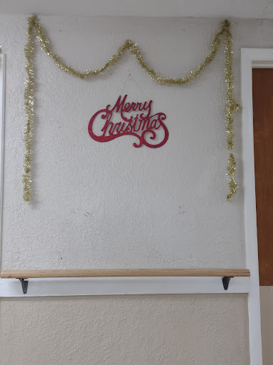 A festive wall decoration celebrating the Christmas season.