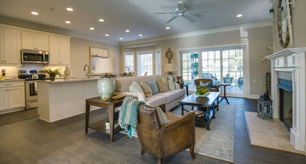 A modern and cozy living room with elegant decor and ample natural light.