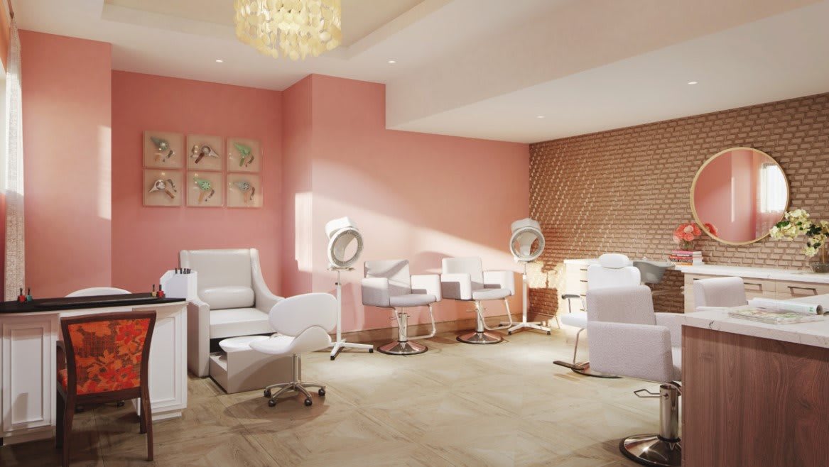 A modern beauty salon interior with pink walls and stylish furniture.