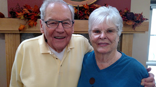 A joyful moment shared between an elderly couple.