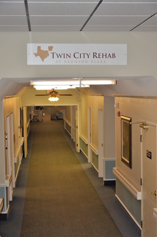 View of a hallway inside Twin City Rehab, a healthcare facility.