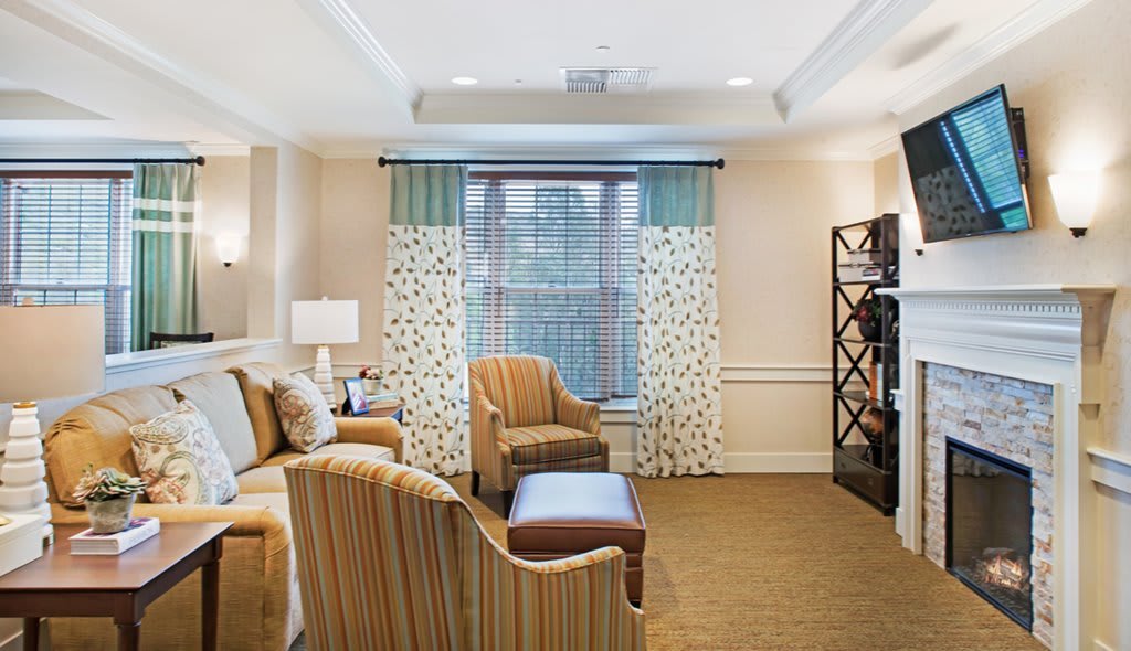 A cozy living room with comfortable seating and elegant decor.