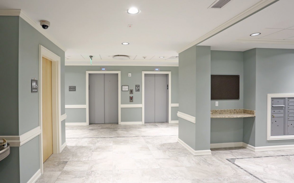 A modern hospital elevator lobby with bright lighting and clean design.