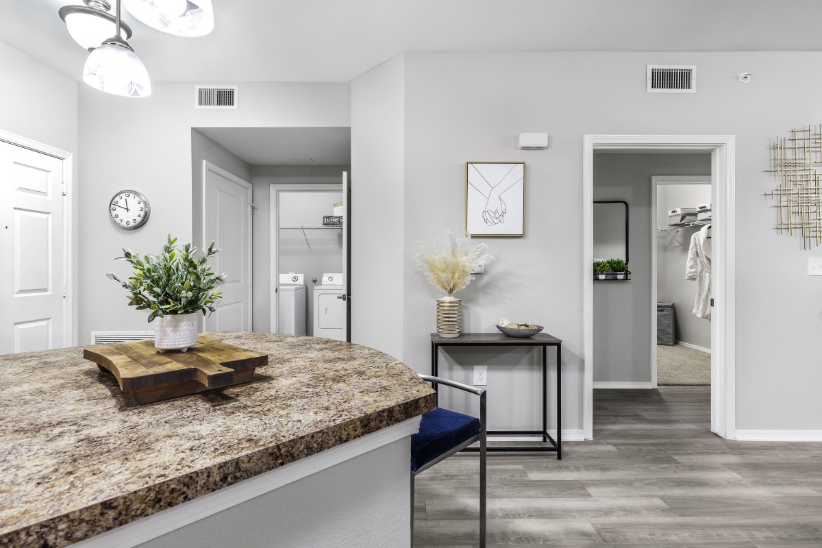 Modern home interior featuring a kitchen area and living space with elegant decor.