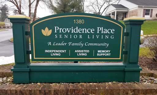 Signage for Providence Place Senior Living, showcasing various living options.