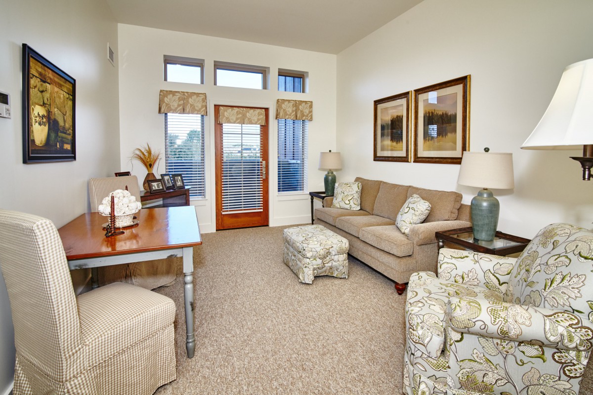 A cozy living room with elegant furniture and decor.