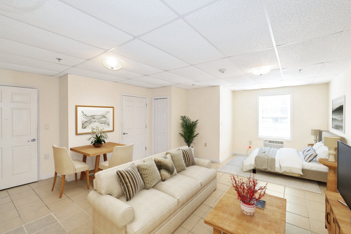 A bright and cozy open-plan living and dining area with neutral decor.