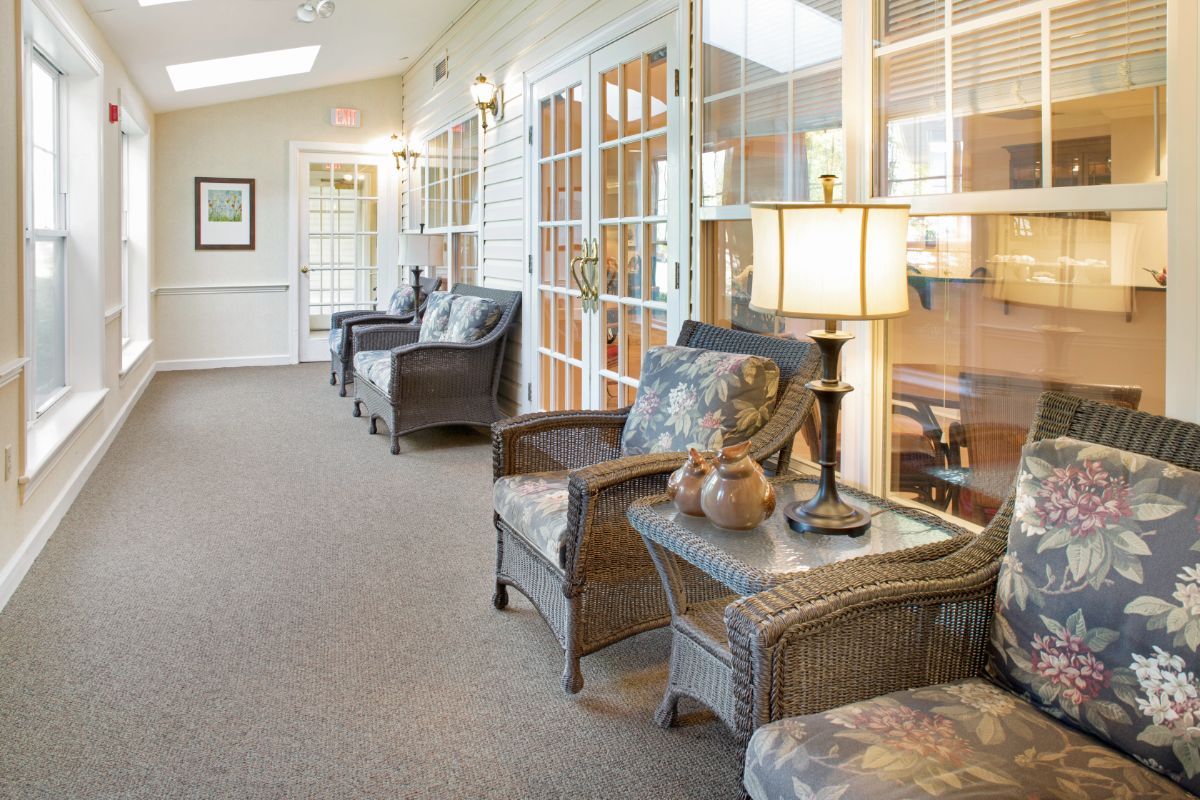 A cozy lobby with wicker furniture and warm lighting.