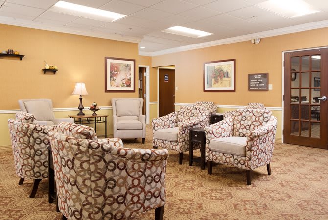 A cozy waiting room with patterned chairs and tasteful decor.