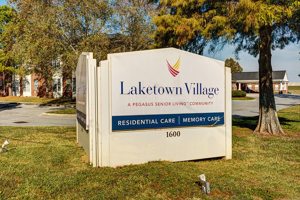 Sign for Laketown Village, a residential and memory care facility.