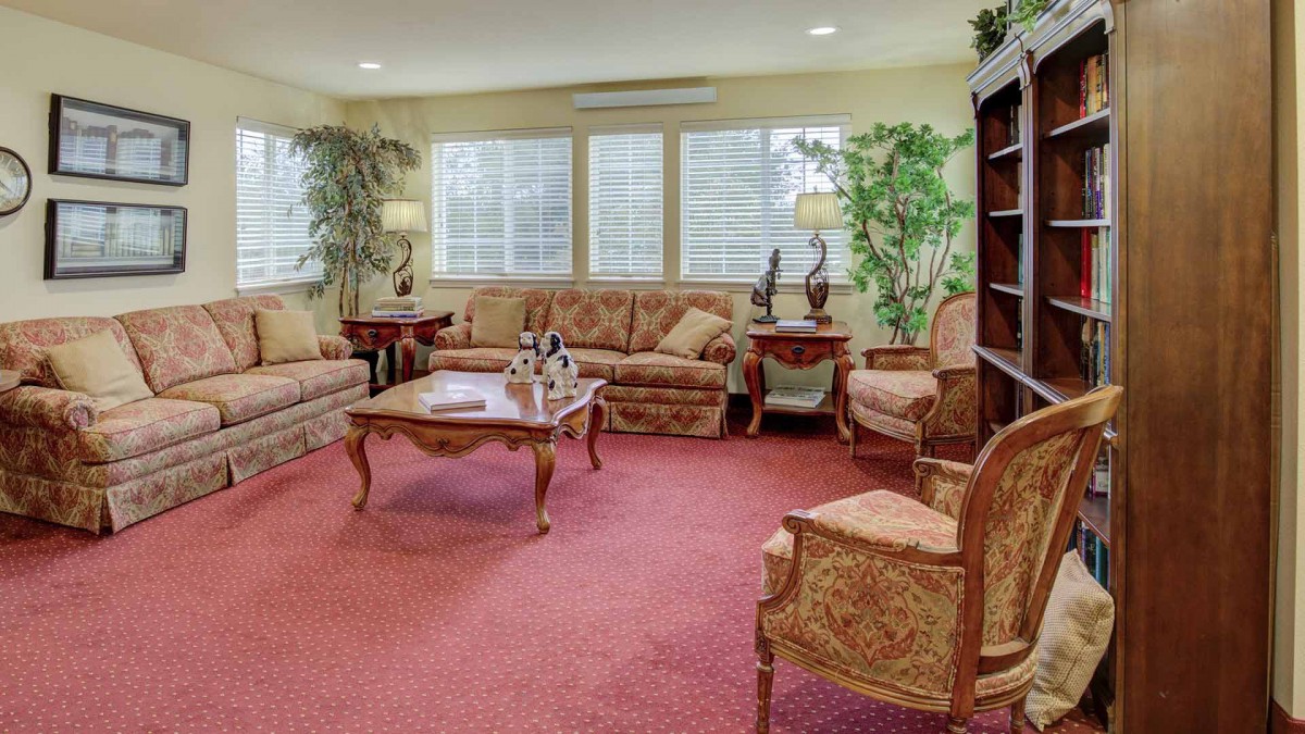 A cozy living room with classic furniture and warm lighting.