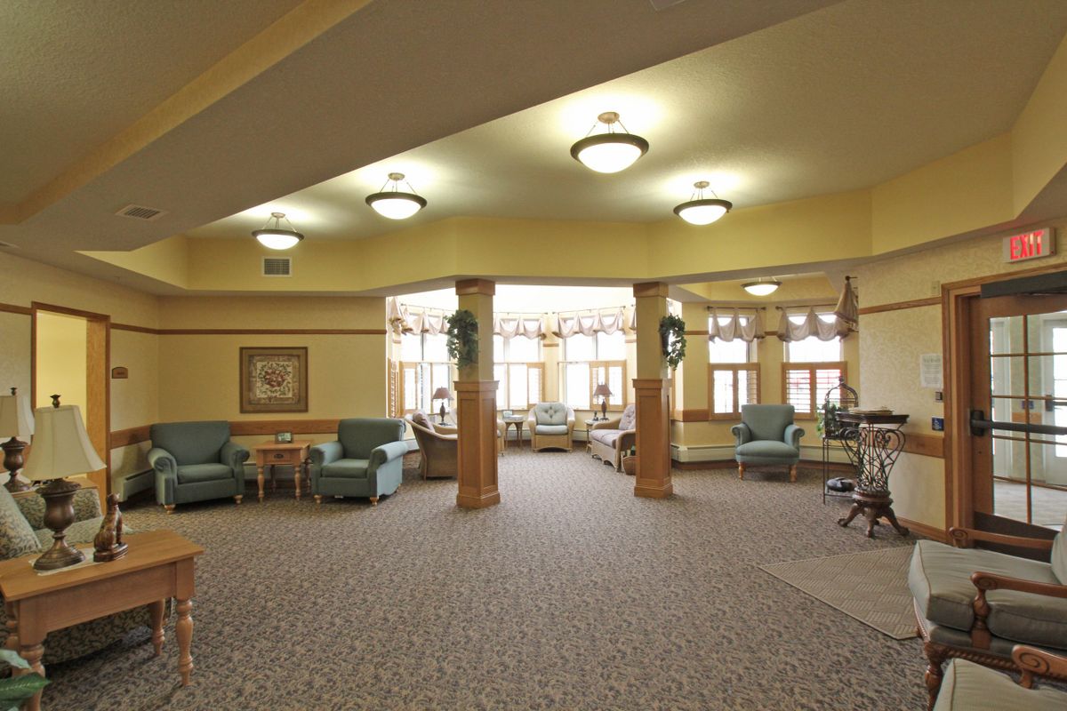 A spacious lobby area with comfortable seating and warm lighting.