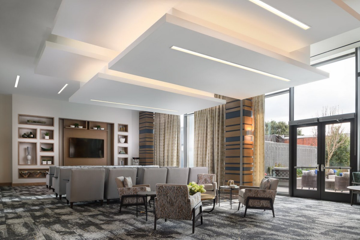 A modern living room with stylish furniture and contemporary lighting.