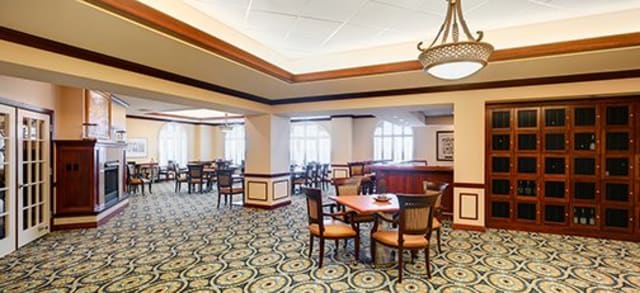 A spacious dining area with elegant decor and multiple seating arrangements.