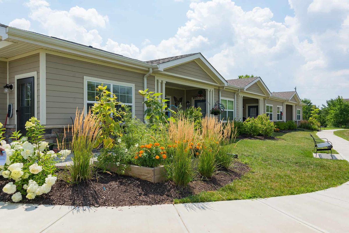 A suburban home with a well-maintained garden and landscaped front yard.