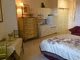 A cozy bedroom with neatly arranged furniture.
