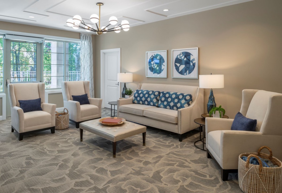 A stylish and comfortable living room featuring modern furniture and decor.