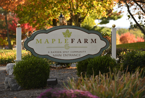 Welcome to Maple Farm, a serene escape surrounded by autumn foliage.