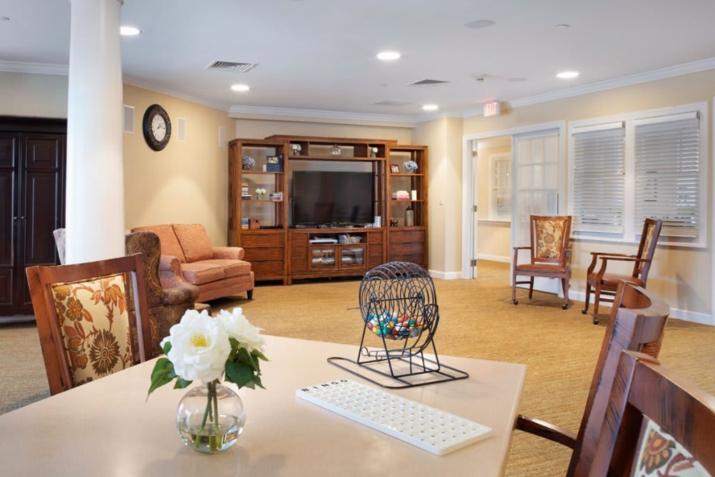 A cozy living room with comfortable seating and a large entertainment center.