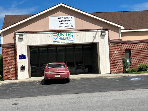 A service building with clear signage and a parked vehicle.