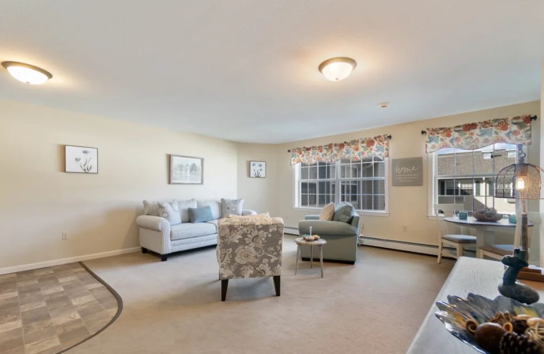 A cozy living room with comfortable seating and natural light.