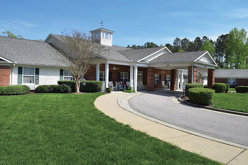 A scenic view of a community care facility on a bright, sunny day.