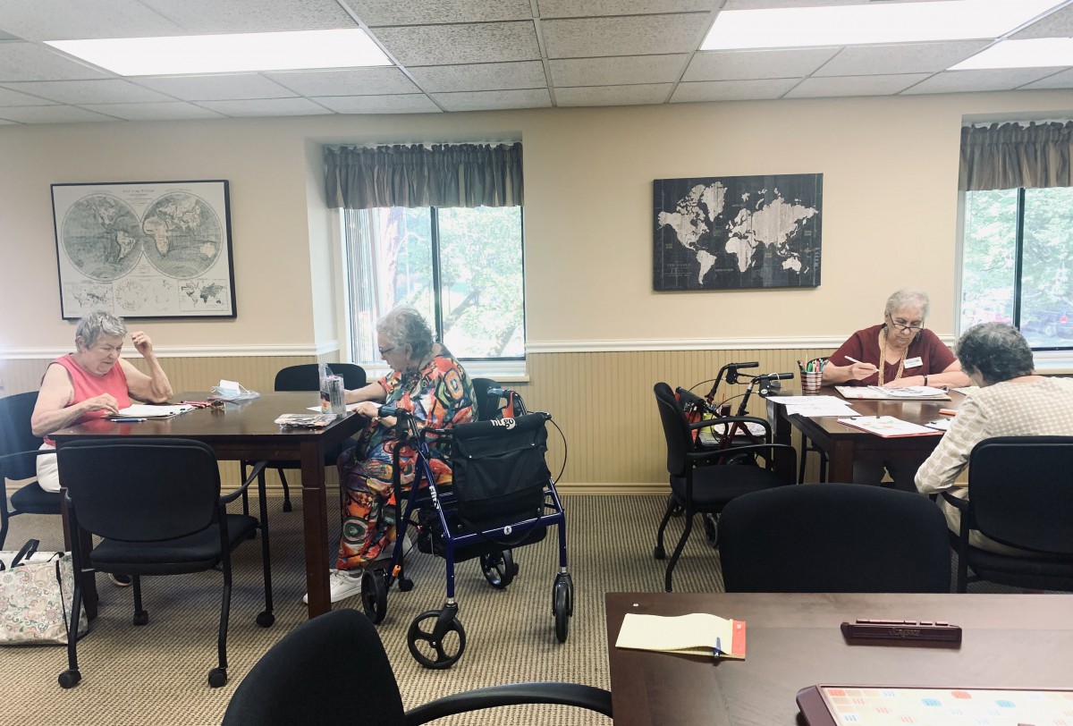 Elderly individuals engaging in activities at a nursing home.