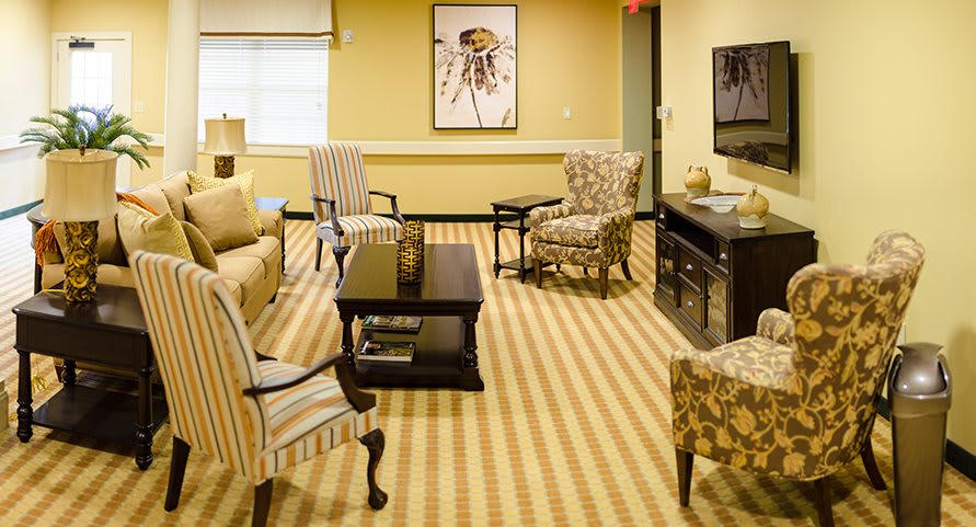 A cozy living room with comfortable furniture and a warm color scheme.