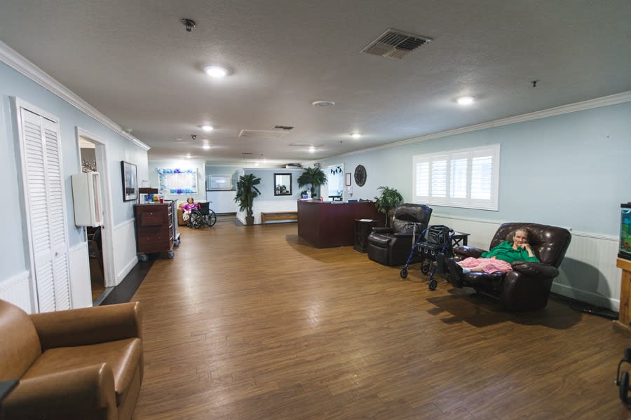 A spacious office lobby with a reception desk and comfortable seating.