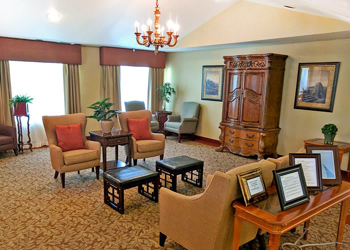 A traditional living room with comfortable seating and elegant decor.