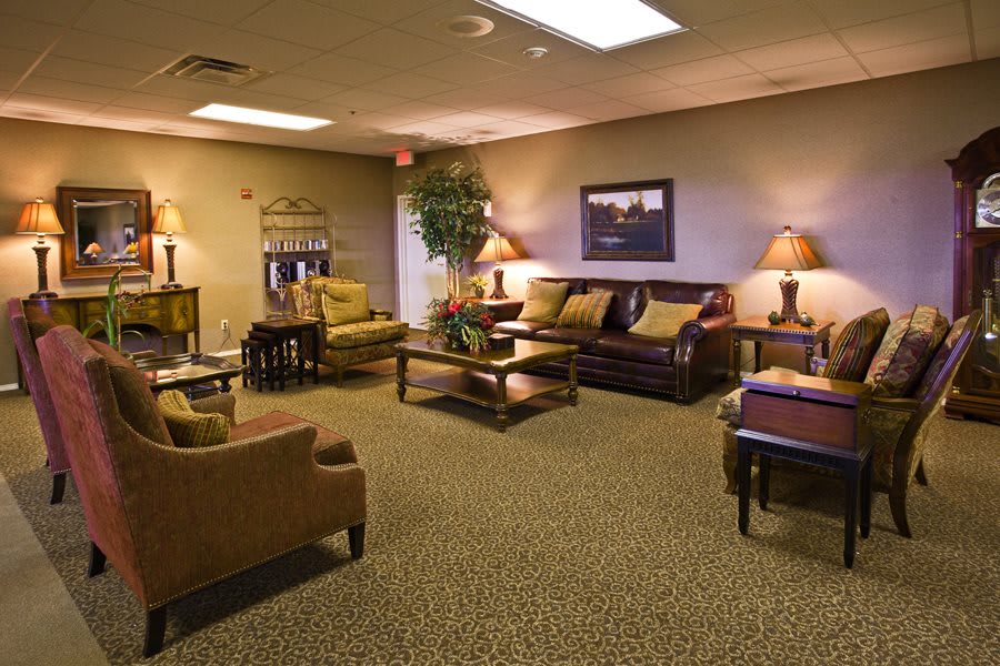 A cozy waiting room with comfortable seating and warm lighting.