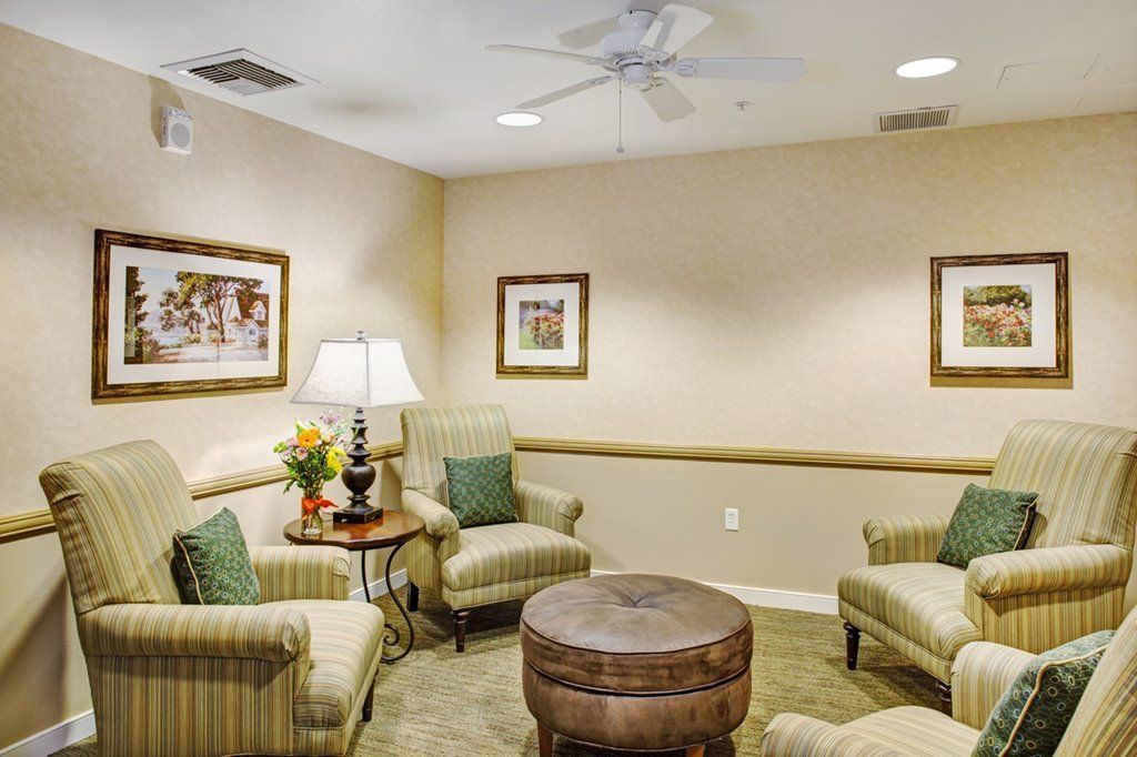 A cozy living room with comfortable seating and warm lighting.
