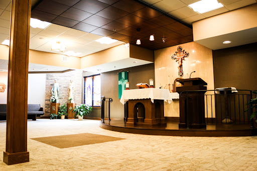 A serene view of the altar in a modern church setting.
