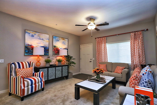 A cozy and stylish living room featuring modern furniture, colorful accents, and beautiful artwork.