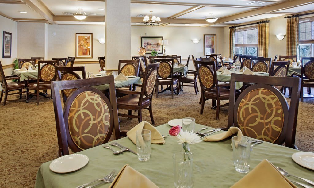 A beautifully set dining room with elegantly arranged tables and chairs.